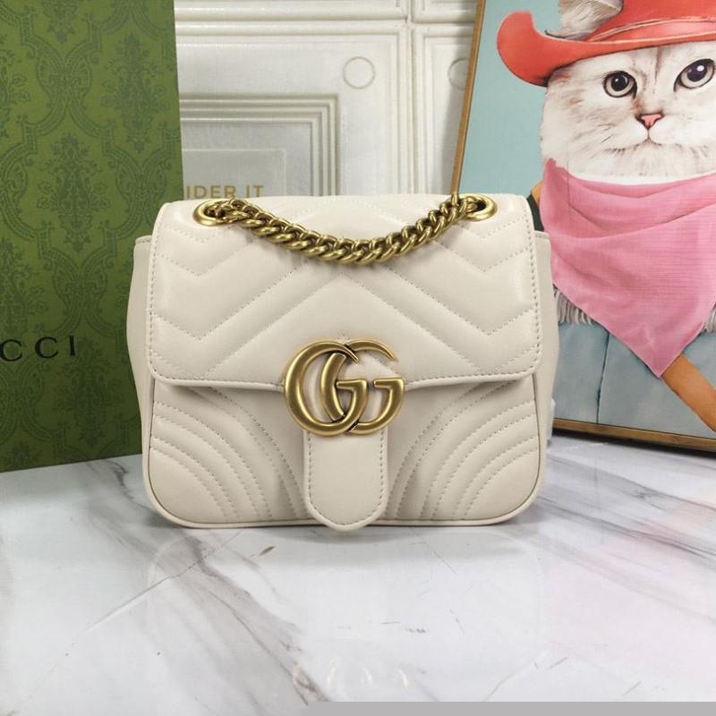 G*u*i clutch bags